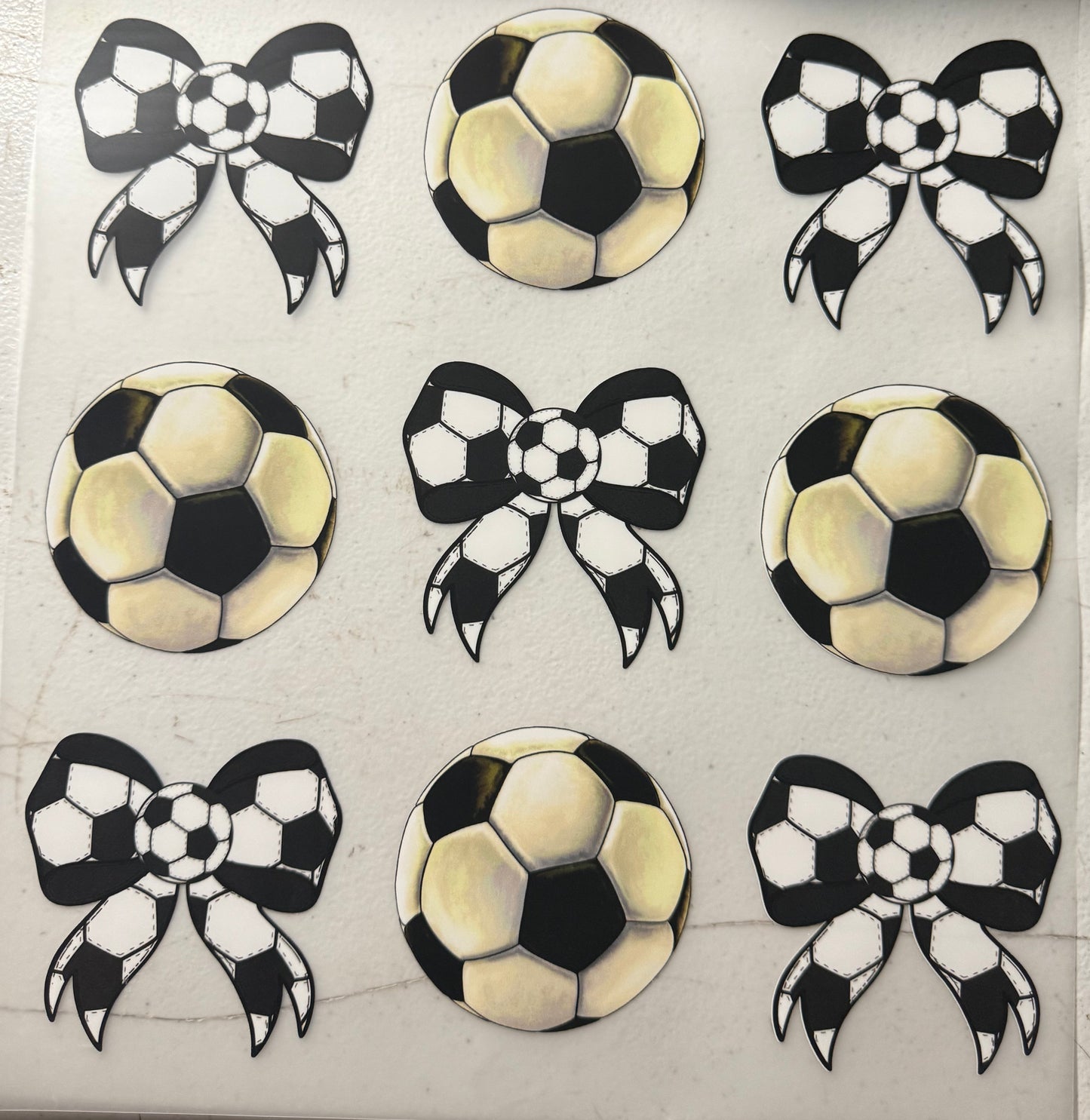 SOCCER BALLS AND BOWS