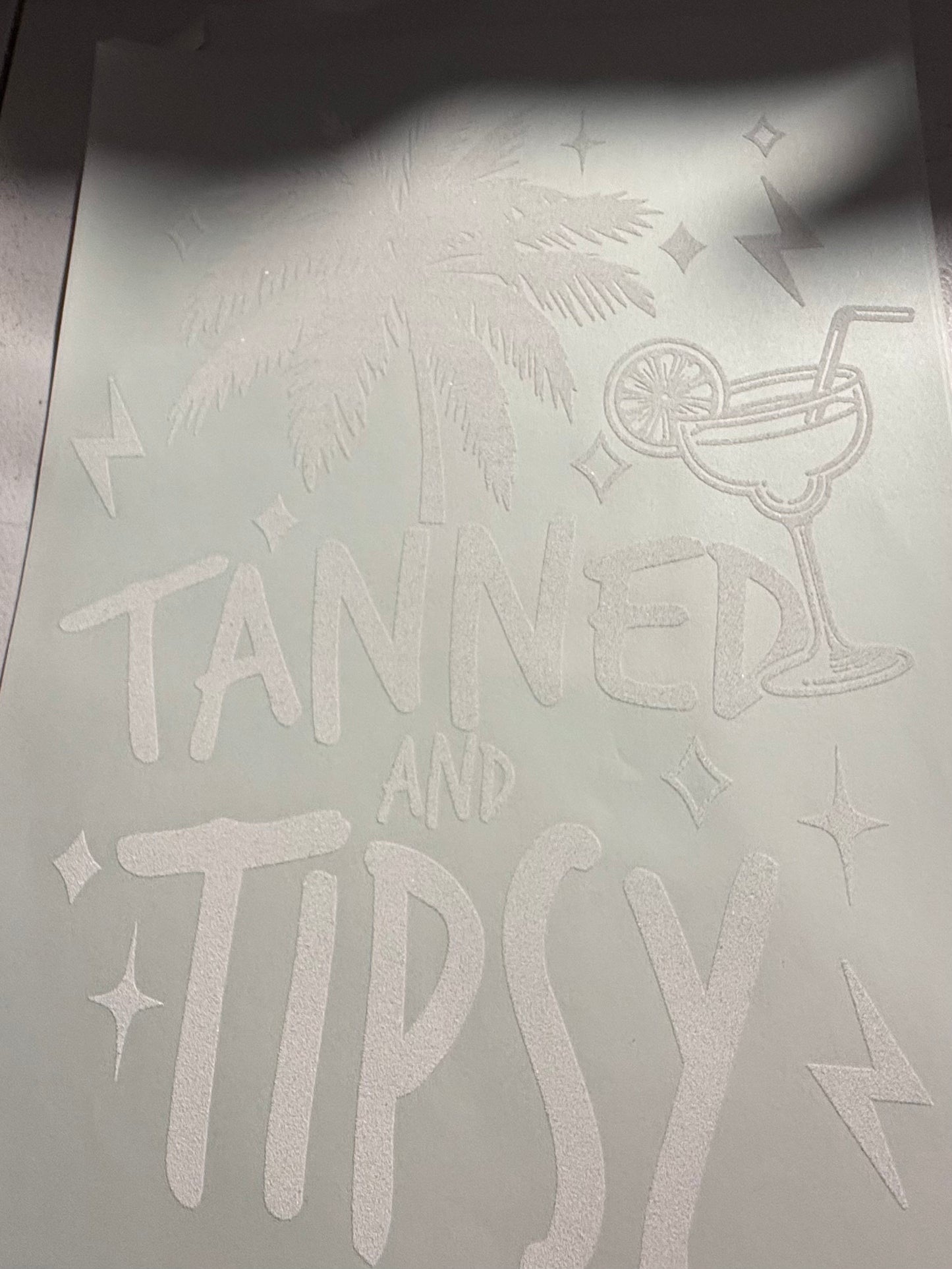 TANNED AND TIPSY
