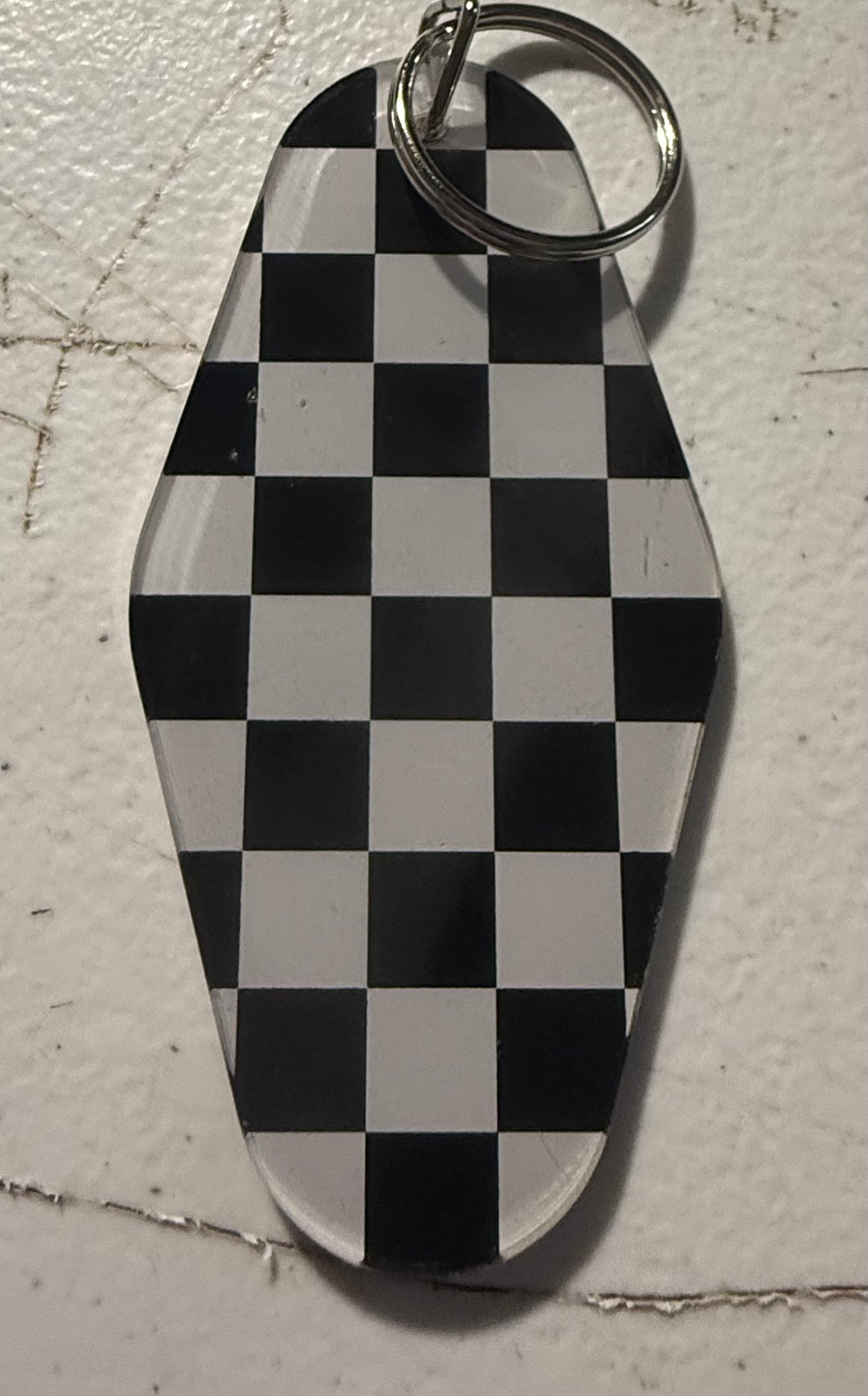 BLACK AND WHITE CHECKERED MOTEL KEYCHAIN