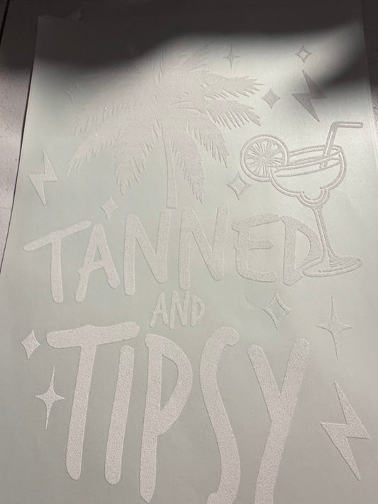 TANNED AND TIPSY