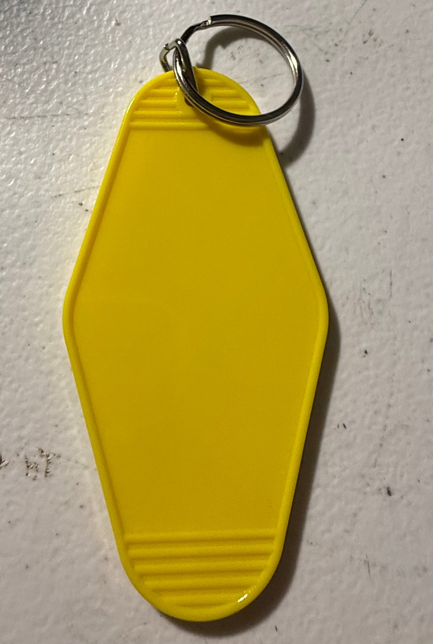 YELLOW MOTEL KEYCHAIN